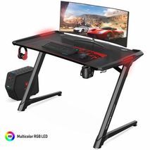 Ergonomic gaming desk with RGB LED lighting. Z-shaped gaming computer desk. Table for computer games.
