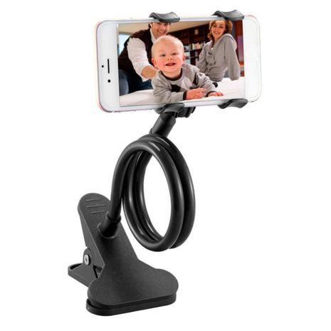 מחזיק הטלפון החכם .על השולחן, ראש המיטה, הכסא, מכונית על גבי קליפס.