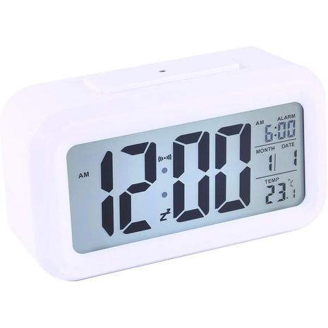 Digital  Alarm Clock with illumination automatically triggered by the onset of darkness Sakal